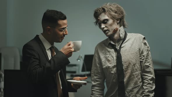 Polite Businessman Talking to Zombie Worker in Office