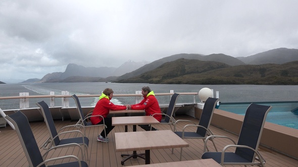 Senior couple traveling together on cruise ship and enjoying with beautiful view of Patagonia.