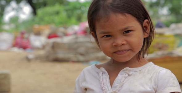 Cambodian Girl In Slums, Garbage in Background