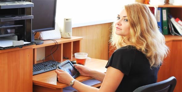 The Girl In The Workplace With The Tablet