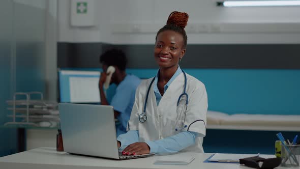 Close Up of Woman with Doctor Occupation Using Laptop