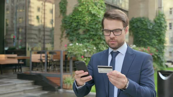 Portrait of Businessman having Online Payment Success on Smartphone