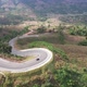 Aerial view of mountain road through tropical forest in countryside of Asia by drone - VideoHive Item for Sale