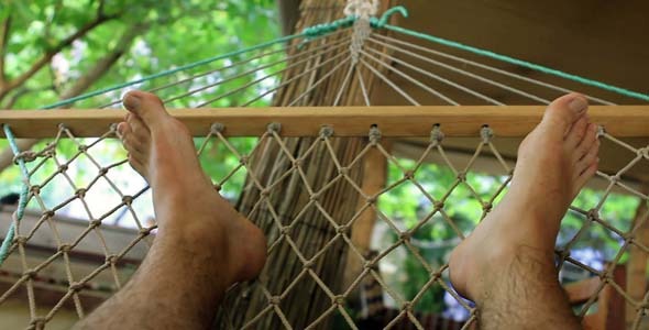 Man Sleeping On Hammock