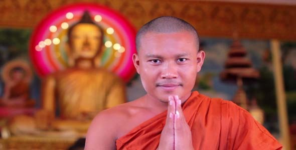 Buddhist Monk With Orange Robe Pray in Temple