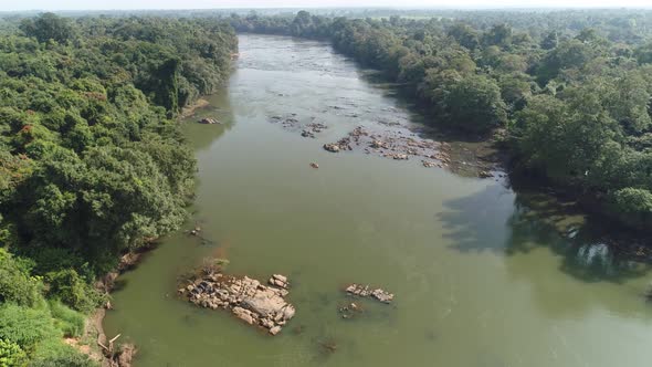 Arcing Canoe On A Jungle River 