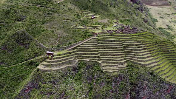 Sacred Valley With Incan Ruins In Towering Mountain Terraces In Pisac, Cusco, Peru. Aerial Tilt-down