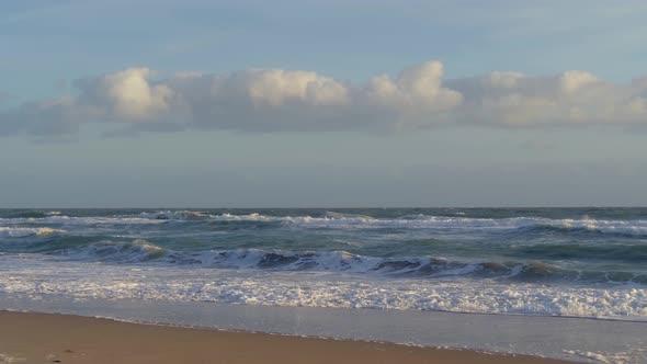 Sandy Ocean Shore in Bright Sunny Day. SLOW MOTION