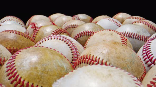 Macro Close-up Shot of Group of Baseball Balls, Black Background