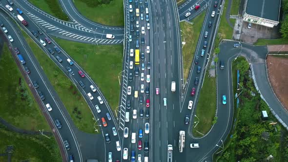 Aerial View of Loaded Cars with Traffic Jam at Rush Hour on Highway with Bridge