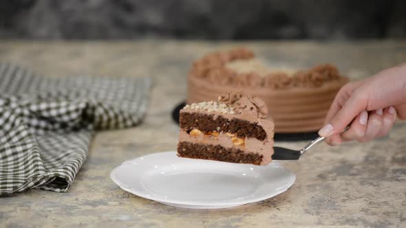 Piece of Delicious Chocolate Cake with nuts and caramel