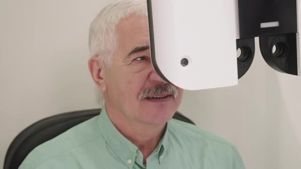 Senior Man Doing Eye Vision Exam