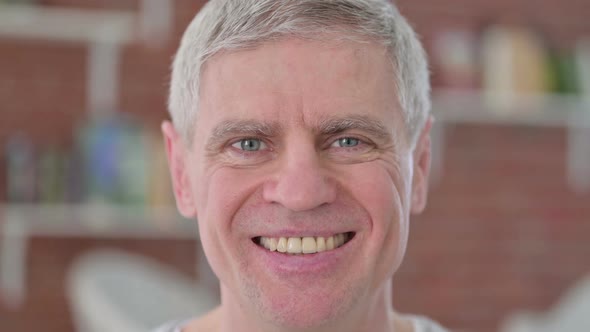 Close Up of Cheerful Senior Old Man Smiling at Camera