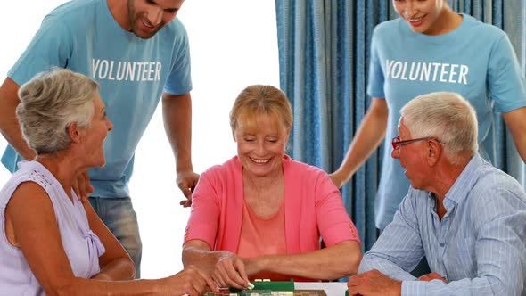 Senior couple playing puzzle