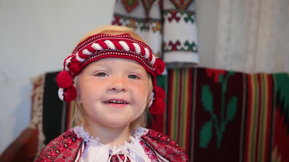 Portrait of a Little Girl in an Old Ukrainian Vyshyvanka Costume Smiling