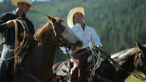 Cowboys on horseback