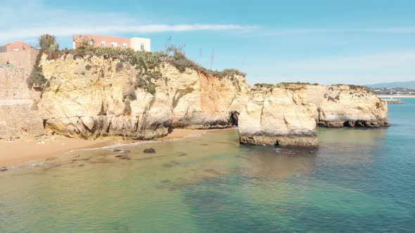 Luxury mansions overlooking secluded beach, Lagos, Algarve. Luxury seaside real estate