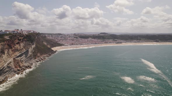 Aerial view of beach of Nazare, seaside town and Atlantic ocean, Portugal