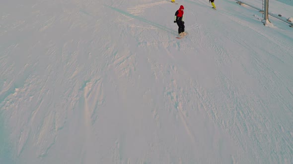 Group Of Young Skiers On Snowy Hill Slope