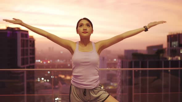 View of Young asian Woman Sitting on Mat and Practicing Yoga