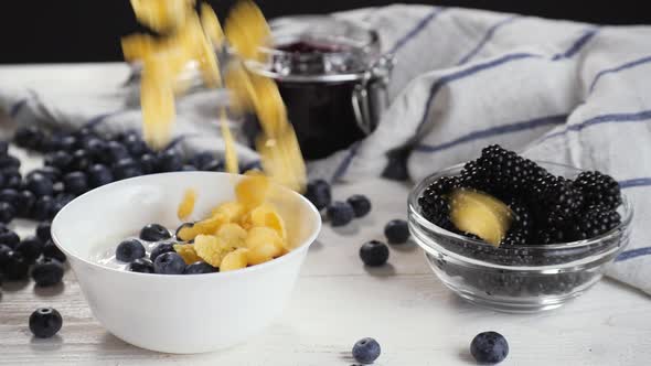 Anonymous Person Adding Cereals To Berries