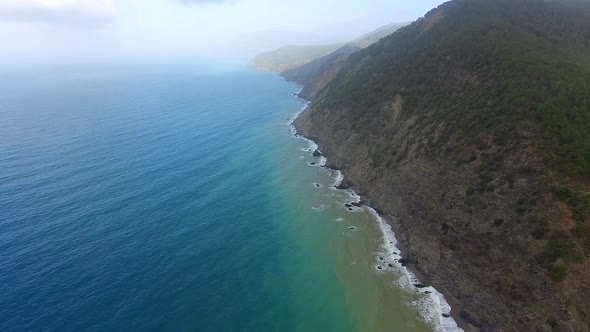 Aerial Fly Over High Rocky Cliff Coast