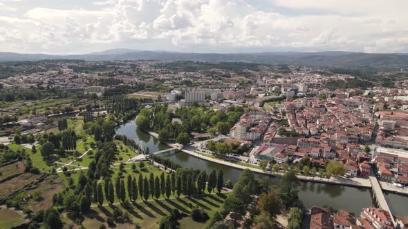 Aerial forward view of Chaves in vast cityscape. Portugal. Daytime. Real time.