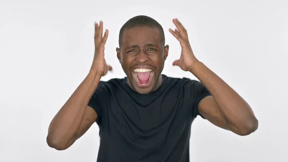 Young African Man Shouting and Screaming on White Background