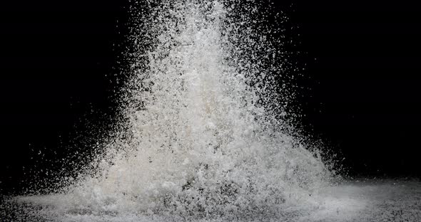 Coconut, cocos nucifera, Powder Exploding against Black Background, slow motion 4K