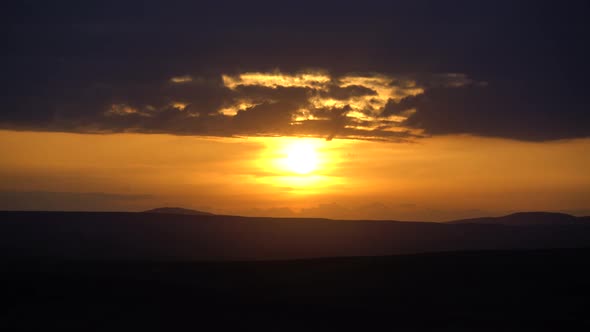 Sunset Over Horizontal Dark Cloud Layers