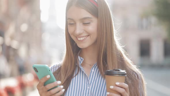 Portrait of Beautiful Fashionable Young Woman with Brown Hair and Headband Wearing Striped Shirt