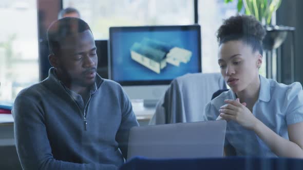 Young man and woman working on computer