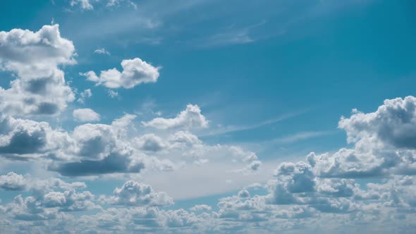 Clouds Float Across the Blue Sky in Shuttles Shape Timelapse