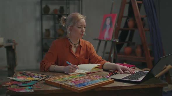 Inspired Woman Learning Art Course Online Using Laptop