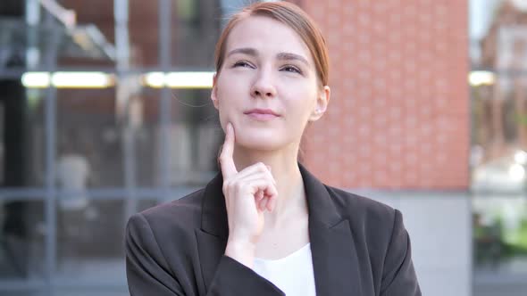 Outdoor Young Businesswoman Thinking New Idea