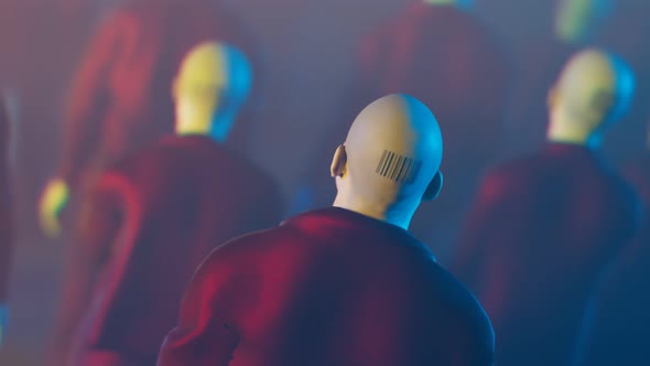 A bald man with a barcode tattoo on the back of his head walking in the crowd.