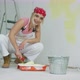 Smiling Female Dipping Paint Roller in Tray - VideoHive Item for Sale