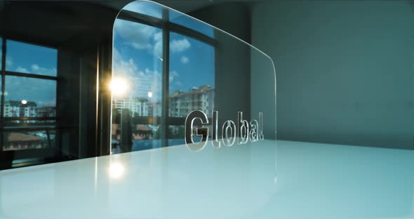 Glass Global Letters and Office in Background