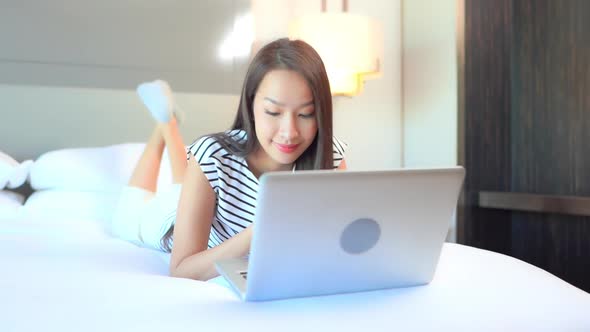 Young asian woman use laptop