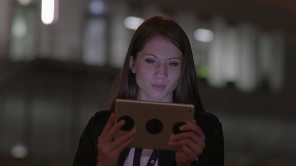 Attractive Female Person Browsing the Internet on Tablet Computer