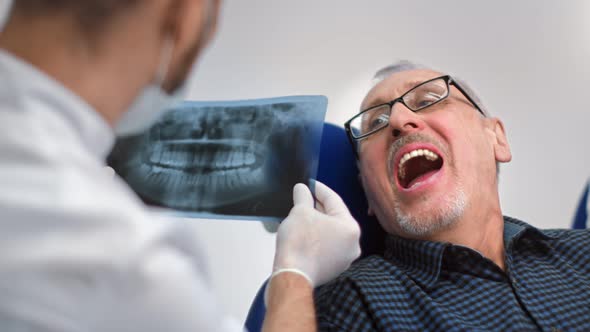 Male Patient of Dental Clinic During Doctor Regular Checkup