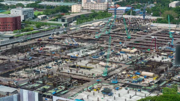 Time lapse of construction site with heavy construction machinery in metropolis