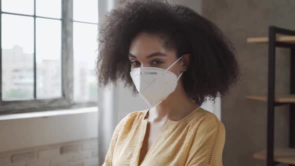 Mixed-race Woman Wearing Protective Medical Mask in the Office. Precautionary Measures for Office