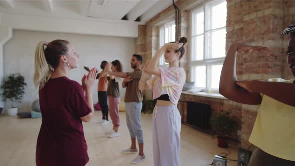 Dance Teacher Working with Group of Multiethnic Students