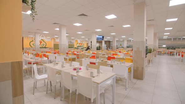 Served Tables and Working TV in Spacious School Canteen