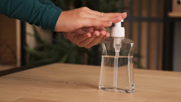 Close-up of Woman Using Hand Sanitizer Gel To Prevent Spreading Virus