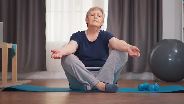 Old Retired Woman Meditating