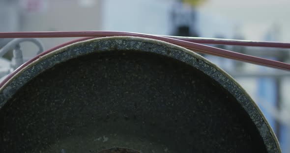 Stretching Two Copper Wires Along a Metal Drum