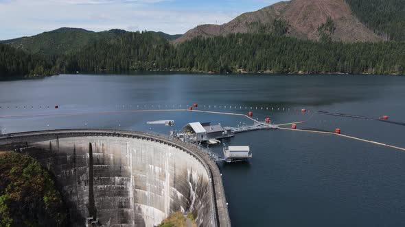 Slowly passing over the small dam on Lake Kokanee, Olympic Peninsula, aerial