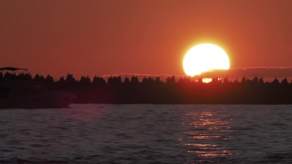 Lighthouse on Gorgeous Sunset Background. Port of Sochi, Russia.